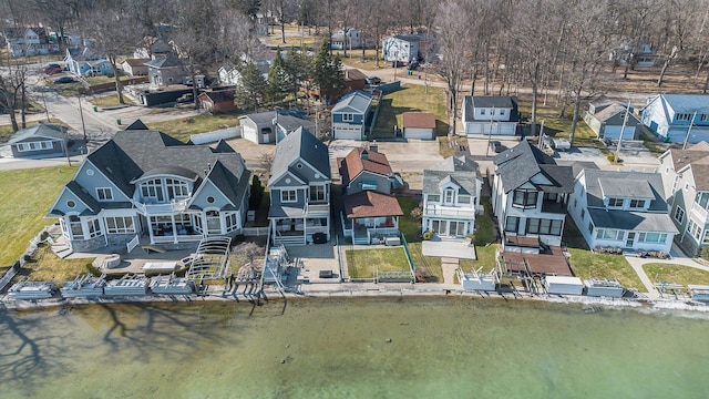 bird's eye view with a residential view and a water view