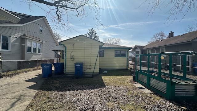 view of home's exterior featuring fence