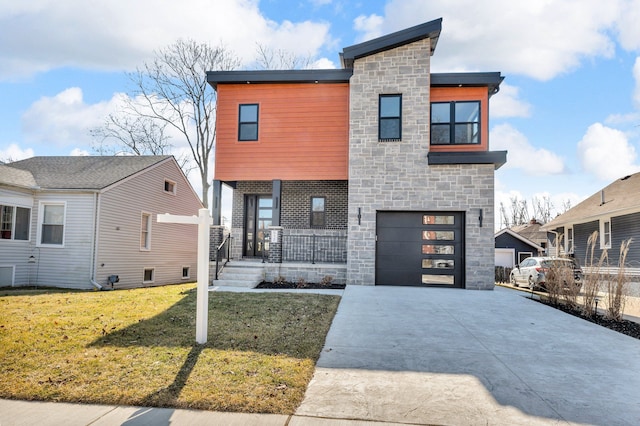 modern home with a front lawn, a porch, concrete driveway, a garage, and stone siding