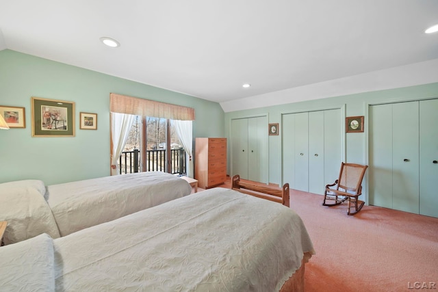 bedroom with two closets, access to outside, recessed lighting, carpet, and lofted ceiling