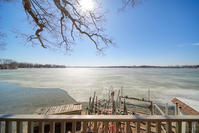 property view of water featuring boat lift and a boat dock