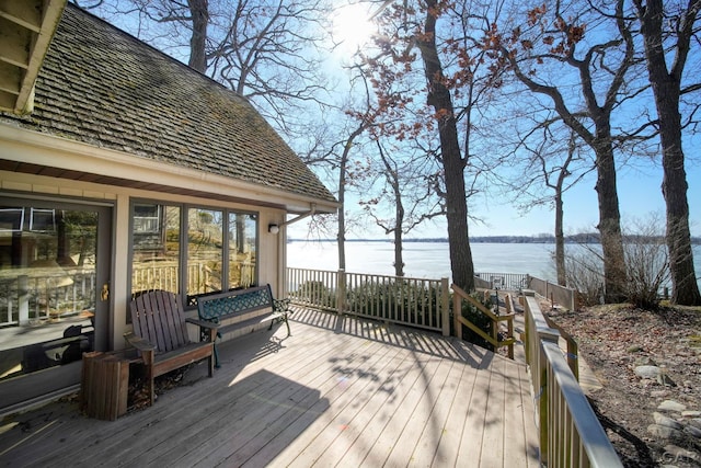 wooden deck featuring a water view