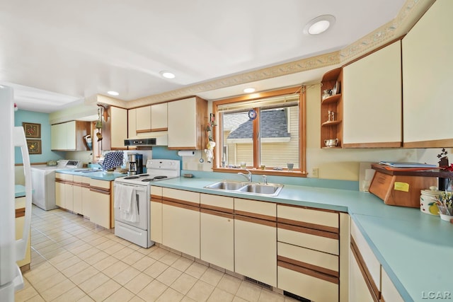 kitchen with a sink, electric stove, under cabinet range hood, recessed lighting, and washer and clothes dryer