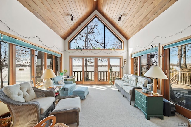 sunroom / solarium featuring wooden ceiling and lofted ceiling