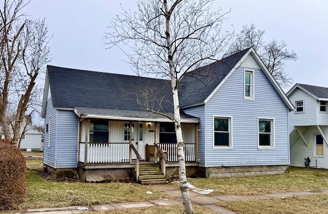 view of front of house featuring covered porch and roof with shingles