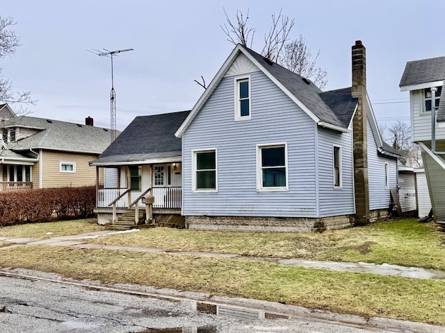 bungalow-style home featuring covered porch, roof with shingles, and a chimney