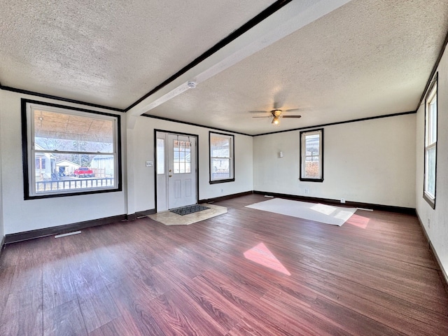 spare room featuring ornamental molding, ceiling fan, and wood finished floors