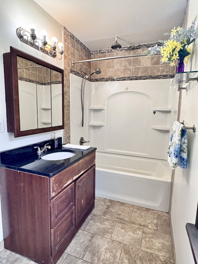 full bath featuring vanity and  shower combination