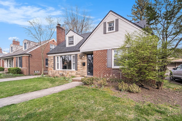 3018 Guilford Dr, Royal Oak, MI 48073 - view of front of home featuring a front lawn, stone siding, a shingled roof, a chimney, and brick siding