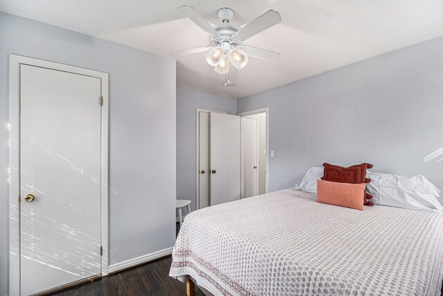 3018 Guilford Dr, Royal Oak, MI 48073 - bedroom with dark wood-style flooring, baseboards, and a ceiling fan