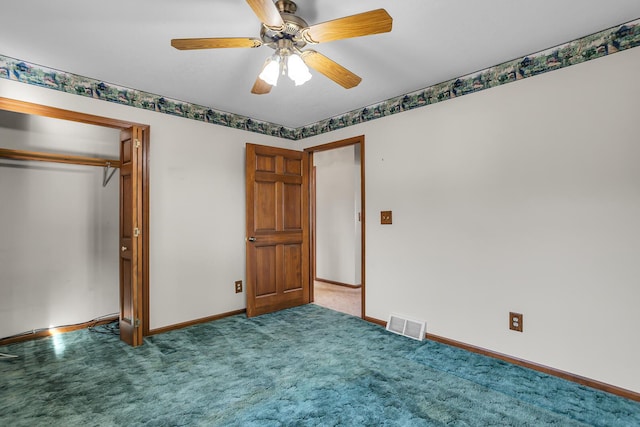 unfurnished bedroom with visible vents, baseboards, a ceiling fan, and carpet flooring