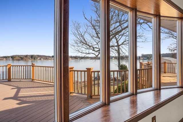 entryway with wood finished floors and a water view