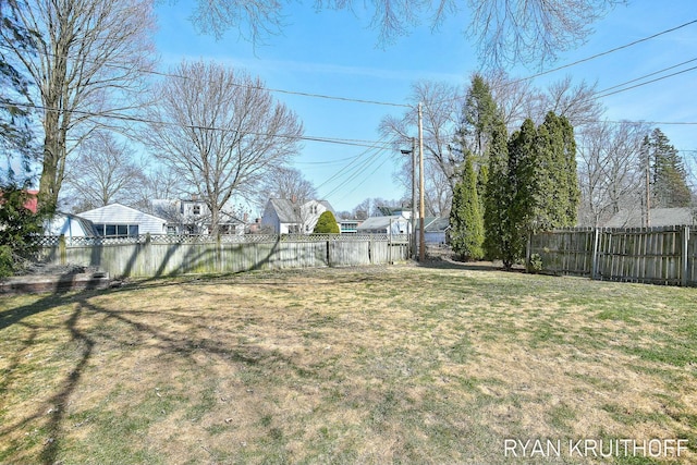 view of yard with a fenced backyard