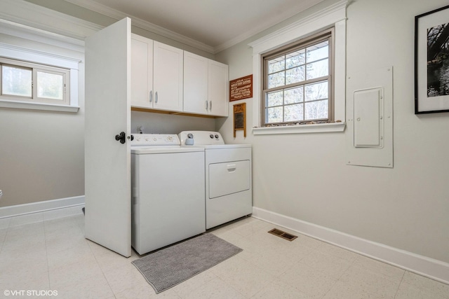 laundry area with baseboards, electric panel, cabinet space, ornamental molding, and washer and dryer