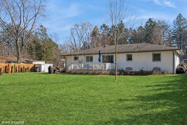 rear view of house with a yard