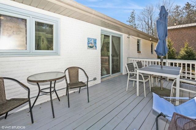 deck featuring outdoor dining area