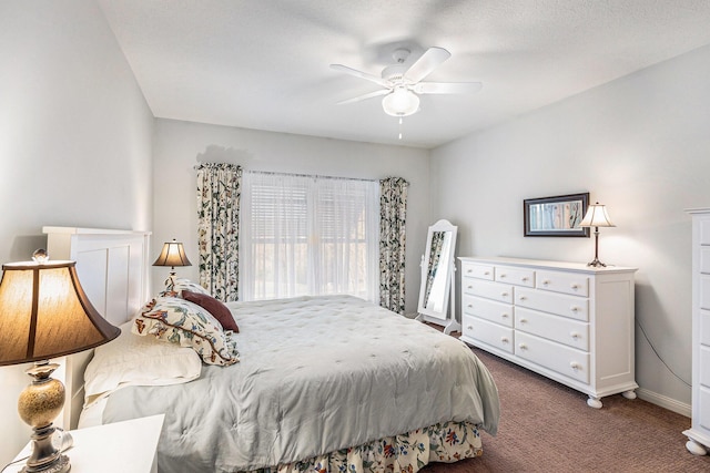 carpeted bedroom with baseboards and ceiling fan