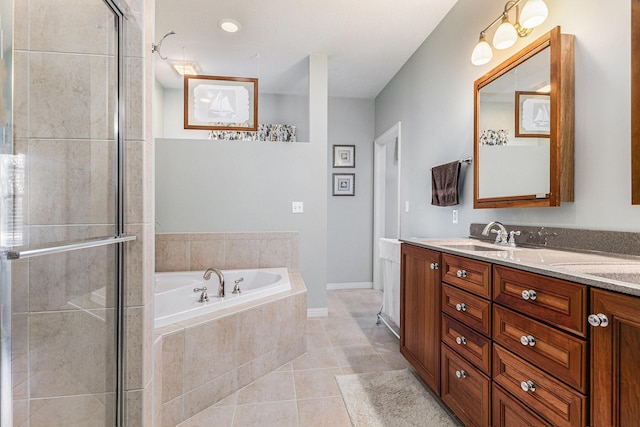 bathroom with tile patterned floors, a garden tub, a shower stall, and vanity