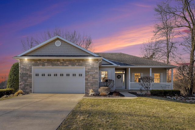 ranch-style home featuring a front lawn, a porch, roof with shingles, concrete driveway, and a garage