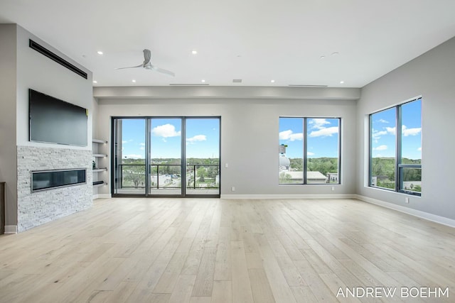 unfurnished living room featuring recessed lighting, ceiling fan, and light wood-style floors