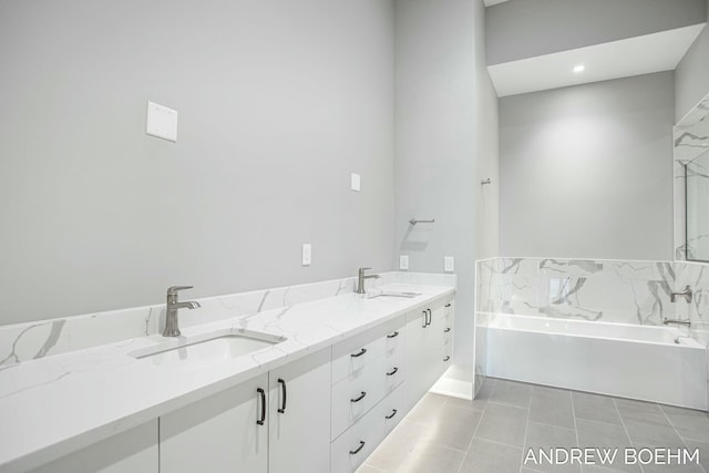 bathroom featuring a sink, a garden tub, double vanity, and tile patterned flooring