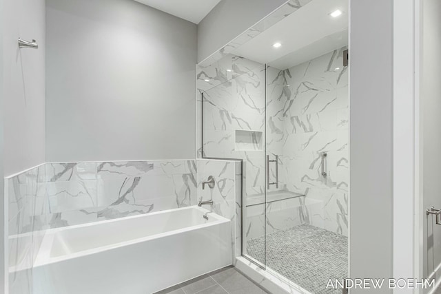 bathroom with tile patterned floors, a bath, recessed lighting, and a marble finish shower