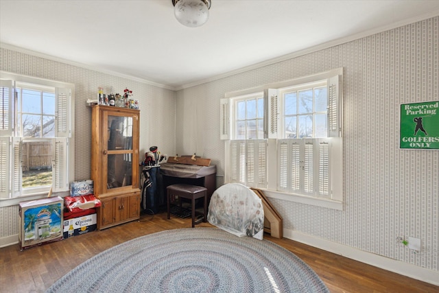 miscellaneous room with baseboards, plenty of natural light, wood finished floors, and wallpapered walls