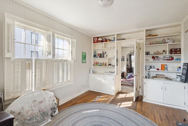 bedroom featuring wallpapered walls, baseboards, and dark wood-style flooring