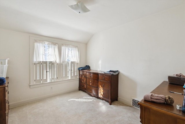 bedroom featuring visible vents, lofted ceiling, baseboards, and carpet flooring