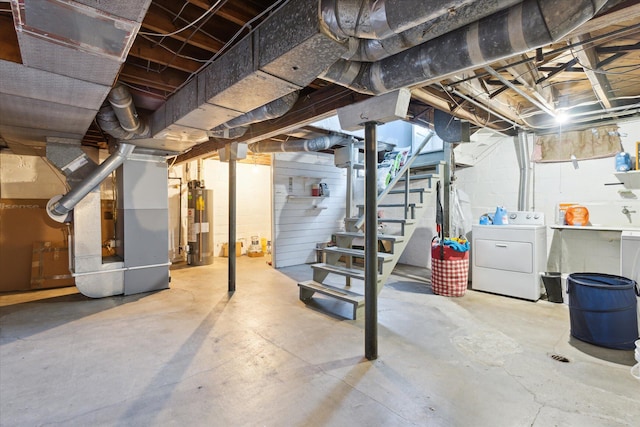 unfinished below grade area with washer / dryer, stairway, heating unit, and water heater