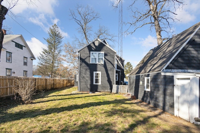 exterior space with a yard and fence