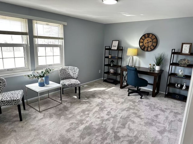 office area with visible vents, baseboards, and carpet flooring