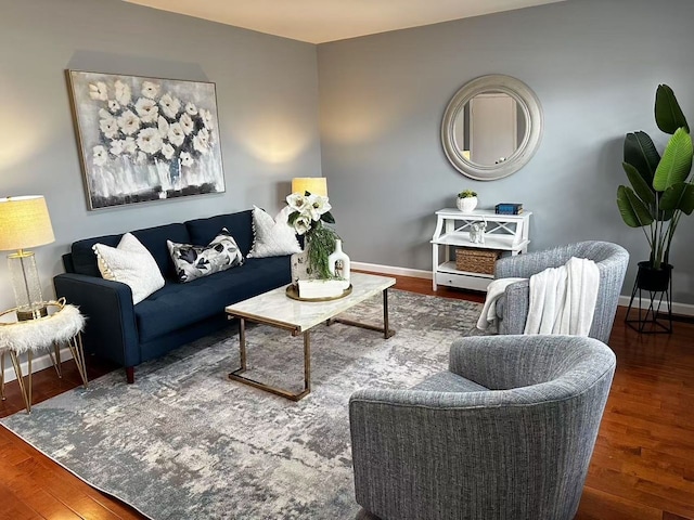 living room with wood finished floors and baseboards