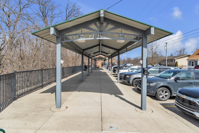 uncovered parking lot with fence