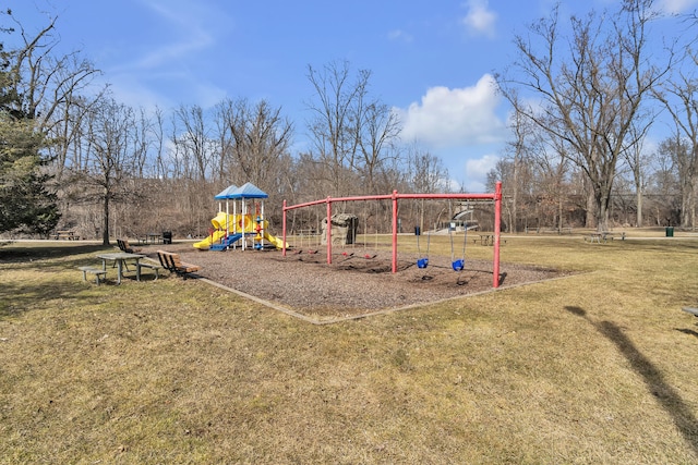 communal playground featuring a yard