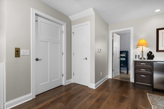 bedroom featuring dark wood-style floors and baseboards