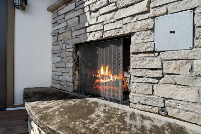 details featuring a stone fireplace