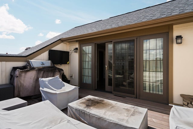 view of patio with a grill and a deck