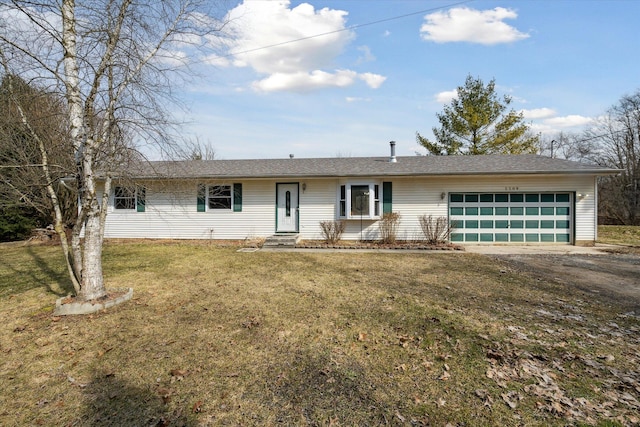 ranch-style home with an attached garage, driveway, and a front lawn