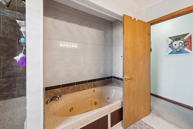 full bath with tile patterned floors and a tub with jets