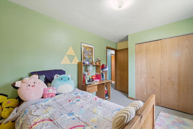 carpeted bedroom with a closet and a textured ceiling