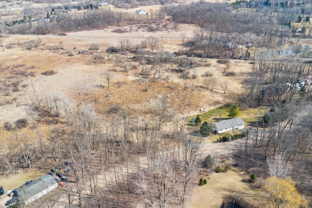 birds eye view of property featuring a rural view