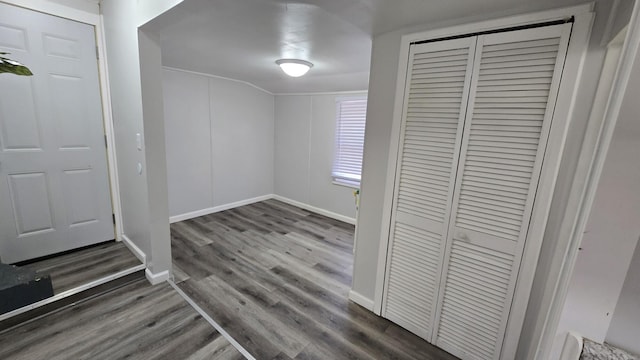 entrance foyer with wood finished floors and baseboards