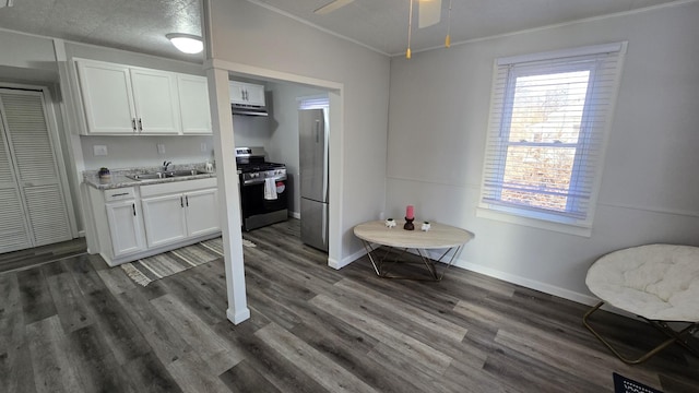 dining space with baseboards, dark wood finished floors, a ceiling fan, and ornamental molding