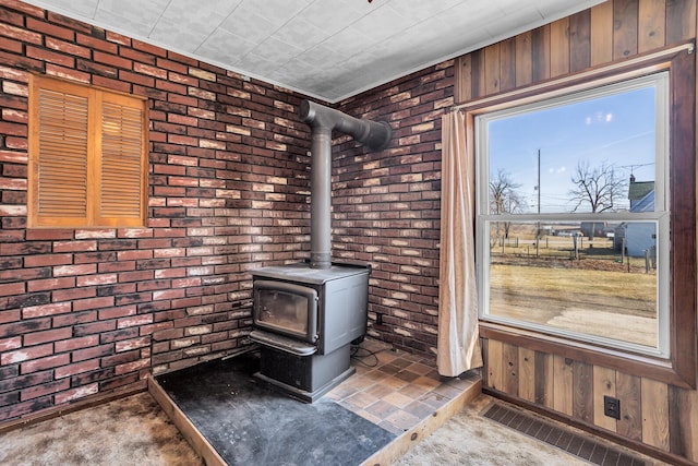 room details featuring a wood stove, wooden walls, and visible vents