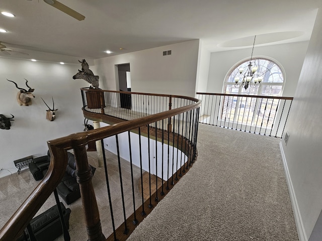 hall featuring visible vents, carpet floors, baseboards, an inviting chandelier, and recessed lighting