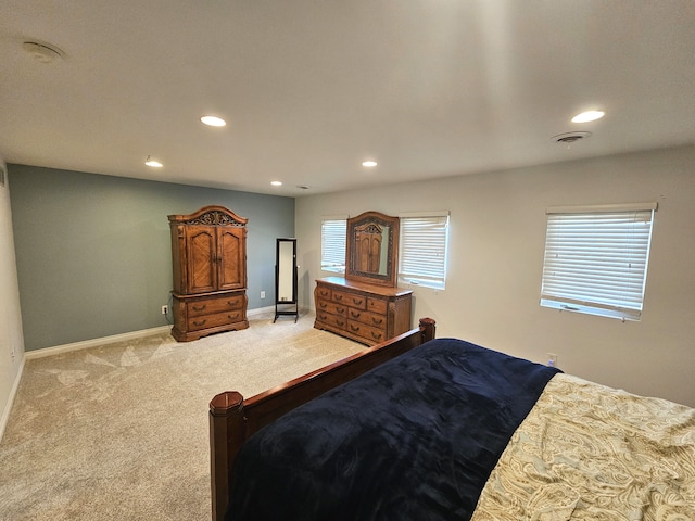 bedroom featuring recessed lighting, baseboards, light carpet, and visible vents