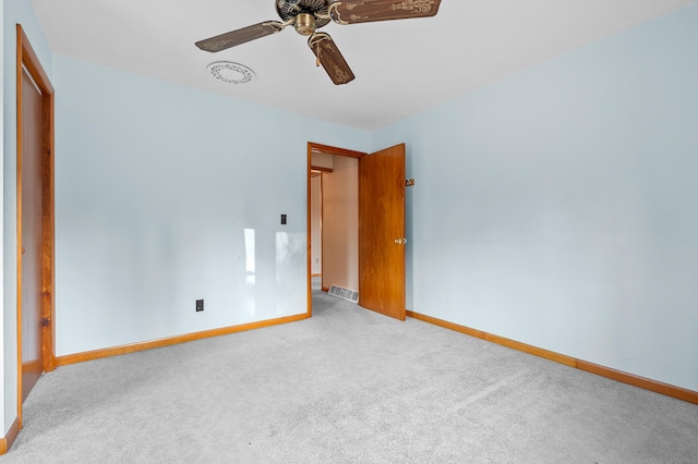 unfurnished bedroom with visible vents, carpet, baseboards, and ceiling fan