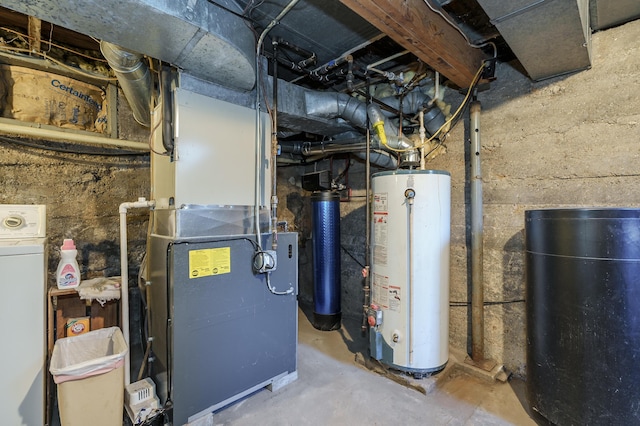 utility room featuring heating unit, gas water heater, and washer / clothes dryer