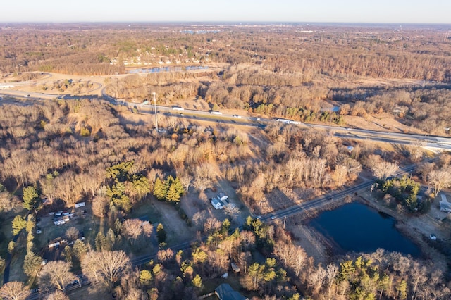 birds eye view of property with a wooded view